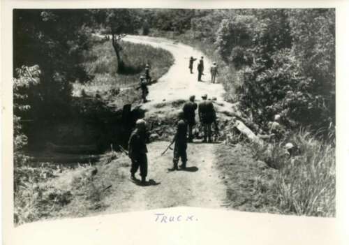 PRCN-01-62: Scene of attack. This photo was taken from the first truck shown in the first photo.